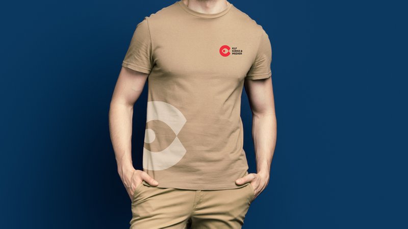 Full size photo of handsome man dressed beige t-shirt stylish trousers keep arms in pockets isolated on dark blue color background